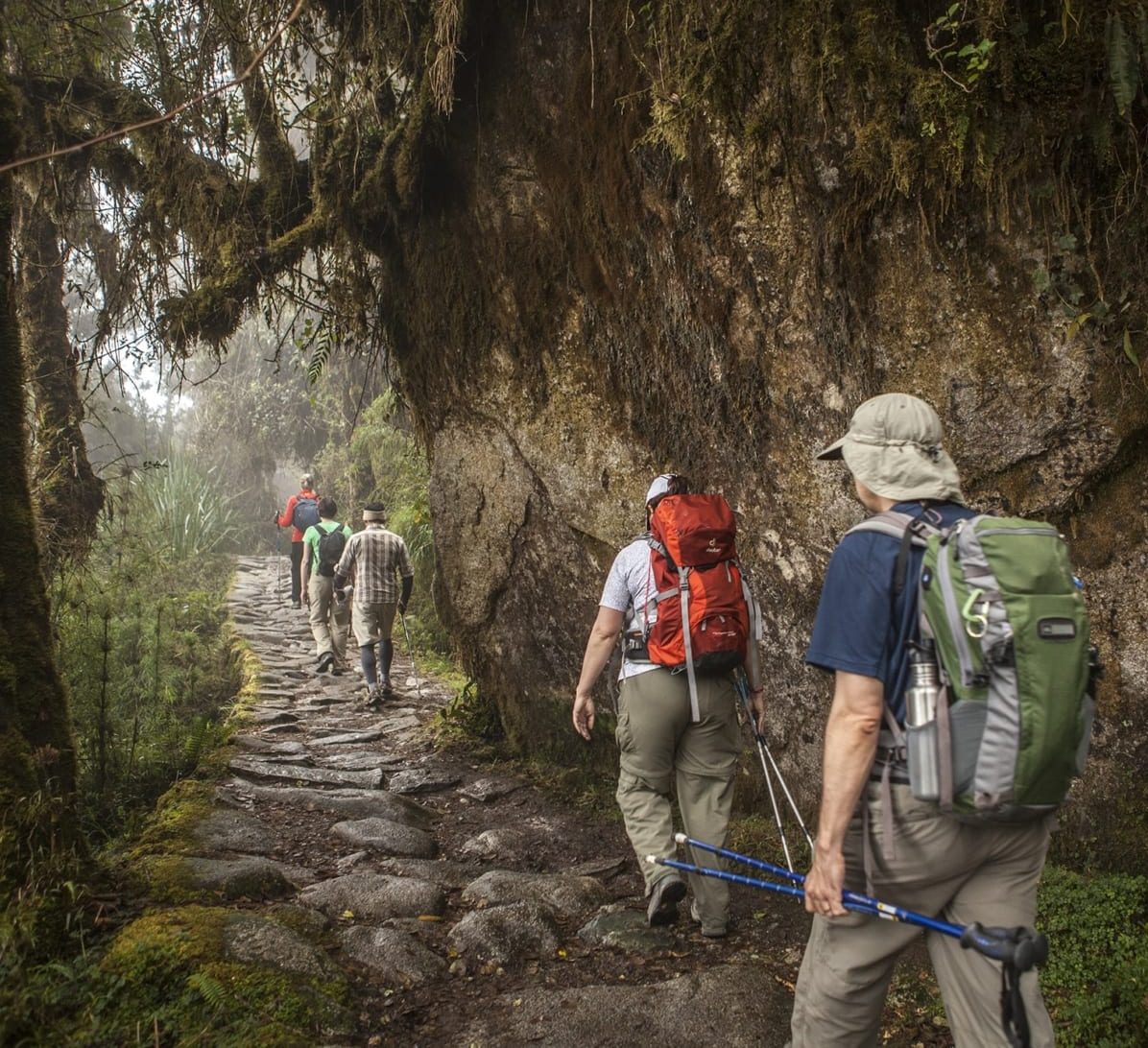 Aerial view of deep Andean valley with layered green mountains on the Classic Inca Trail route to Machu Picchu