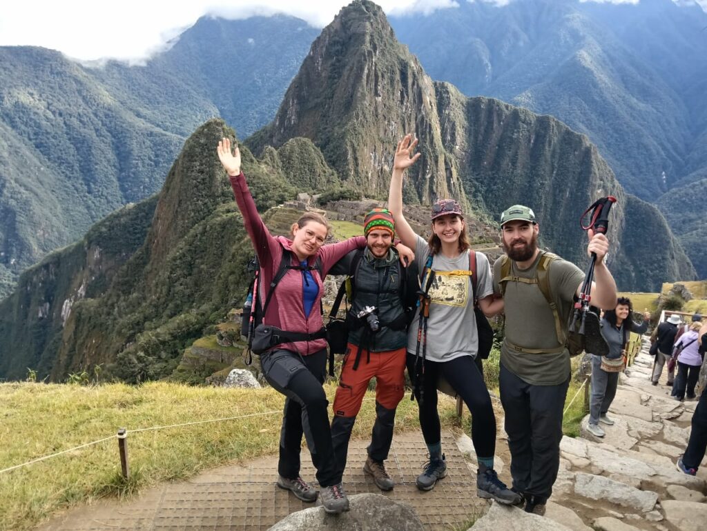 Salkantay trek 4 days trekkers celebrating arrival at Machu Picchu after completing the route