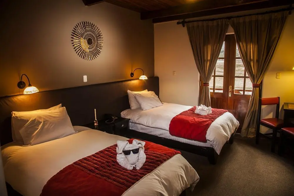 Salkantay trek 4 days mountain lodge interior with comfortable beds and warm lighting